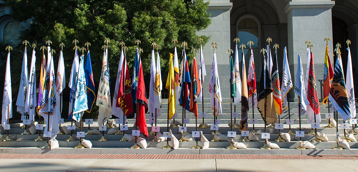 Tribal flags are displayed during Native American Day on the south steps of the California State Capitol.