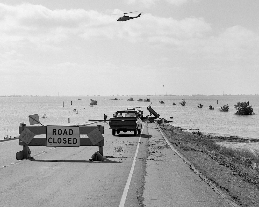 A photo from the California Department of Water Resources of Highway 12 just east of the Rio Vista Bridge was blocked by floodwaters after a levee failed in the vicinity of the Spindrift Marina on June 21, 1972 in the Brannan-Andrus Levee Maintenance District. A Federal Disaster was declared on June 27 within the Sacramento-San Joaquin Delta region. The levee repair was conducted by the U.S. Army Crops of Engineers and the breach was closed on July 26. Photo taken June 23, 1972.