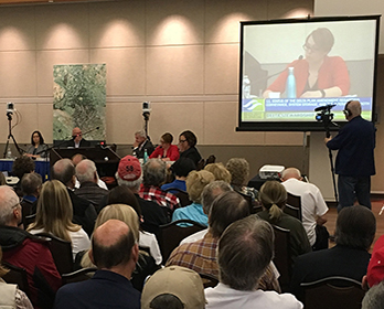 An Early Council Meeting with Jessica Pearson presenting.