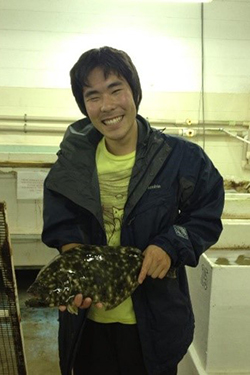 2021 Bay-Delta Science Conference oral presentation third place awardee Yuzo Yanagitsuru holding a fish.